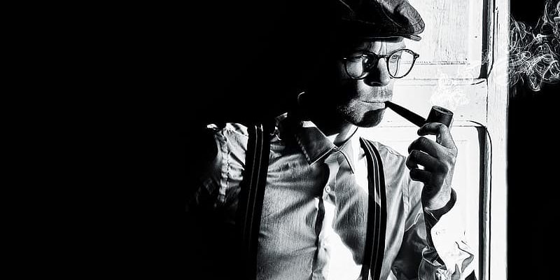 man-in-black-jacket-wearing-black-knit-cap